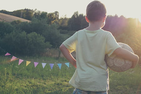 boy holding soccer ball thumbnail