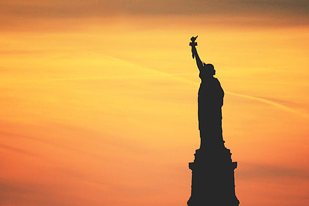 Silhouette of the Statue of Liberty in New York City thumbnail