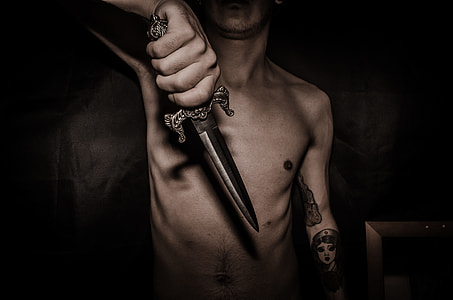 topless man holding dagger thumbnail