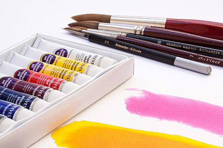 five makeup brushes and labeled bottle thumbnail
