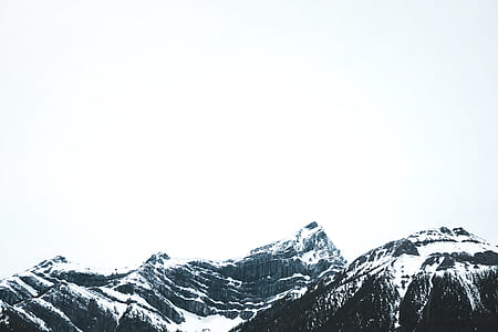 rocky mountain filled with snow at daytime thumbnail