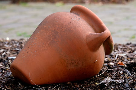 brown clay vase on ground thumbnail