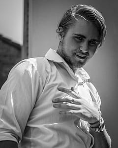 Man Wearing White Top thumbnail