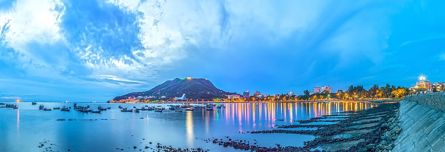 panoramic photo a volcano near water thumbnail