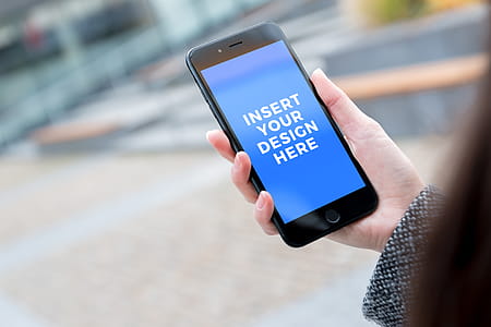 Free PSD Mockup. Woman at Office Center uses iPhone 7 Black Jet thumbnail