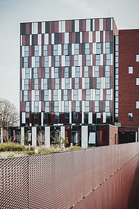 photo of white and brown concrete building during daytime thumbnail