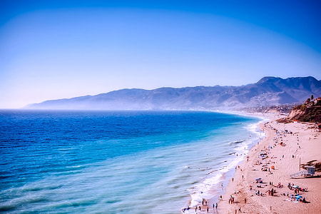 aerial photography of beach with crowded people thumbnail