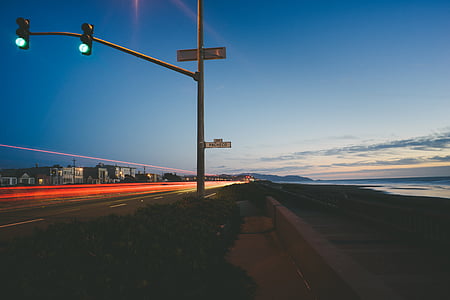 traffic lights near body of water thumbnail