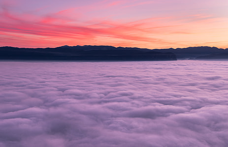 silhouette of mountain with clouds during sunset thumbnail