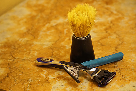 two shavers beside makeup brush thumbnail