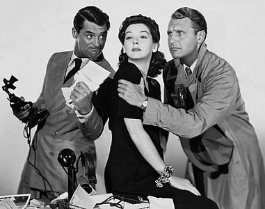 grayscale photo of woman between two men thumbnail