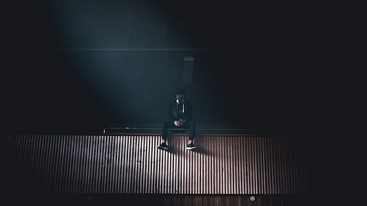 person sitting on ledge thumbnail