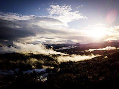 high angle photo of mountain range covered with clouds thumbnail
