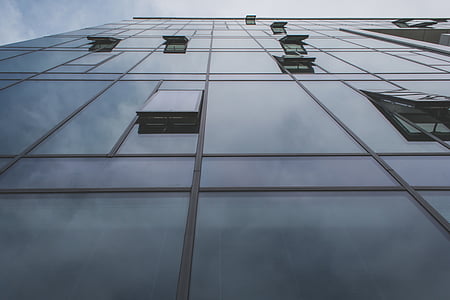 worm's-eye view of glass panels of building thumbnail