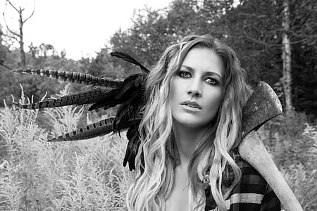 woman holding axe gray scale photo thumbnail