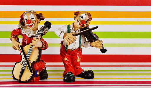 two multicolored musician clown figurines thumbnail