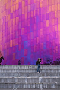 Woman Standing on Stair Taking Picture thumbnail
