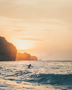 man swimming at beach thumbnail