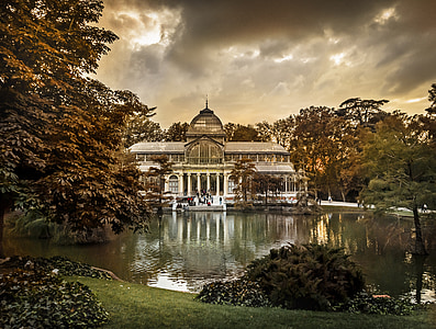 white domed building near lake during cloudy day thumbnail