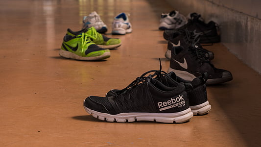 several pairs of shoes on floor thumbnail
