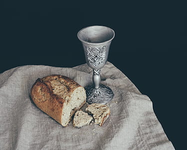 gray steel cup beside sliced bread thumbnail