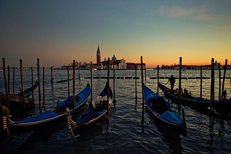 five blue boat on body of water during dawn thumbnail