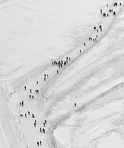 people walking on mountain covered of snow thumbnail