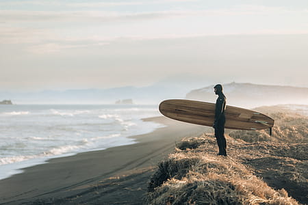 Man Holding Surfboard thumbnail
