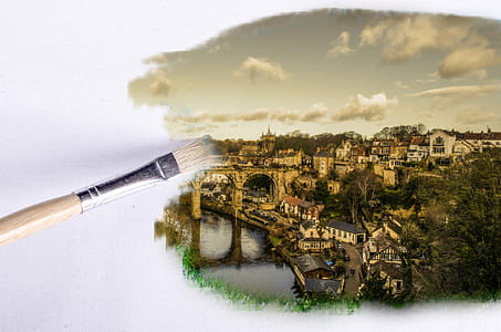 closeup photo of houses near the water painting with paint brush thumbnail