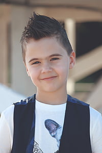boy wearing white crew-neck t-shirt and black vest thumbnail