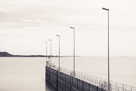 gray concrete dock with black light post thumbnail