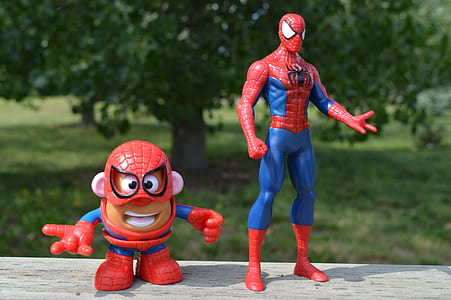 Spider-Man action figure beside Mr. Potato Man toy thumbnail
