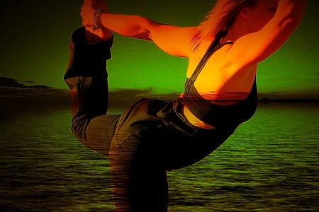 woman wearing black sports bra and black pants exercising near body of water thumbnail
