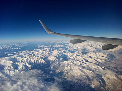 plane window photography of airliner wing thumbnail