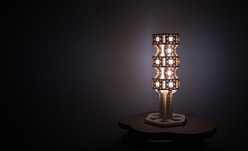 lighted brass-colored table lamp thumbnail