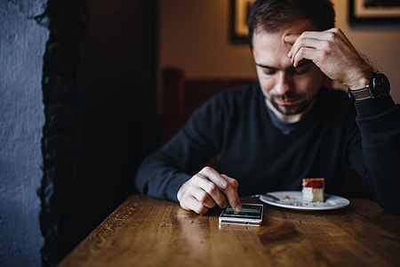 Young Elegantly dressed man sititng in a cafe thumbnail
