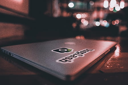 silver Apple MacBook on wooden table thumbnail