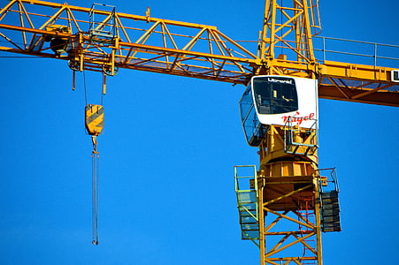 yellow and white crane tower during daytime thumbnail
