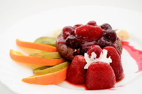 close-up photo of sliced lime and strawberries on white plate thumbnail