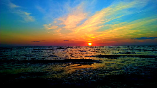 Body of Water Under Blue and Whit Sky thumbnail