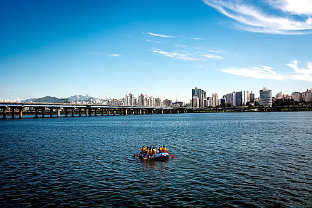 people riding on boat on body of water thumbnail