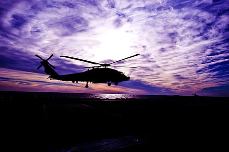 black aircraft under white clouds thumbnail