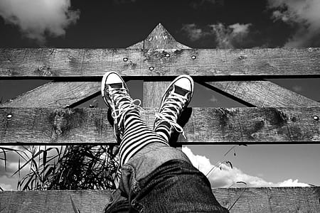 Grayscale Photo of Person's Shoes thumbnail
