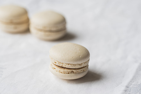 selective focus photography of macaron on white textile thumbnail