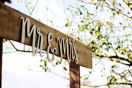 closeup photo of mr & mrs hanging signage thumbnail