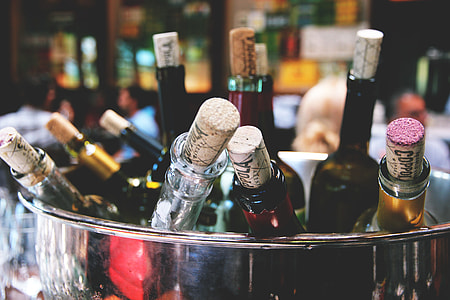 Closeup shot of wine bottles and corks thumbnail