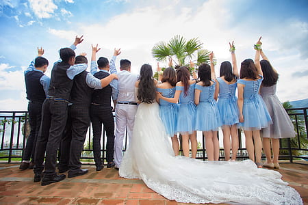 people gathering beside black fence thumbnail