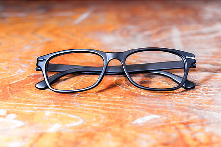 selective focus photography of black framed eyeglasses thumbnail