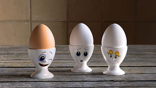 three eggs on round white racks thumbnail