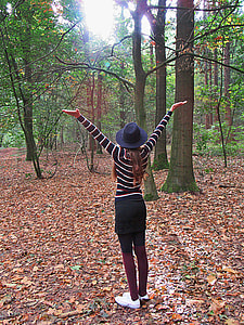 woman standing near tree thumbnail